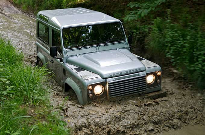 The 2007 Defender wades through mud on its launch